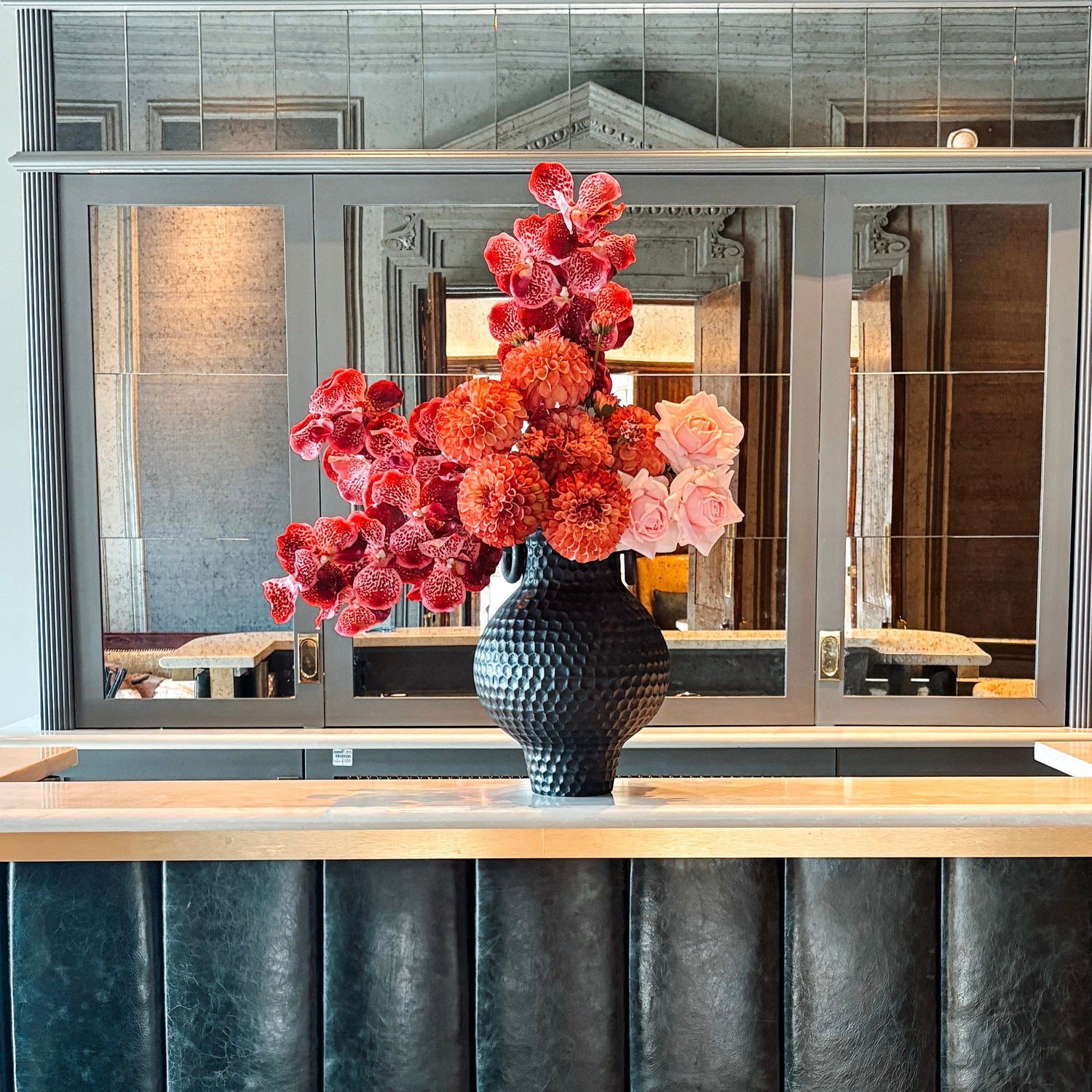 Luxury faux flowers styled in a modern London interior